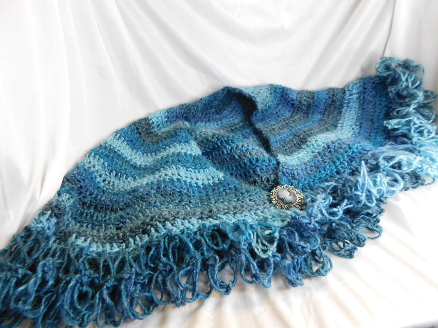 Blue shawl with cameo clasp