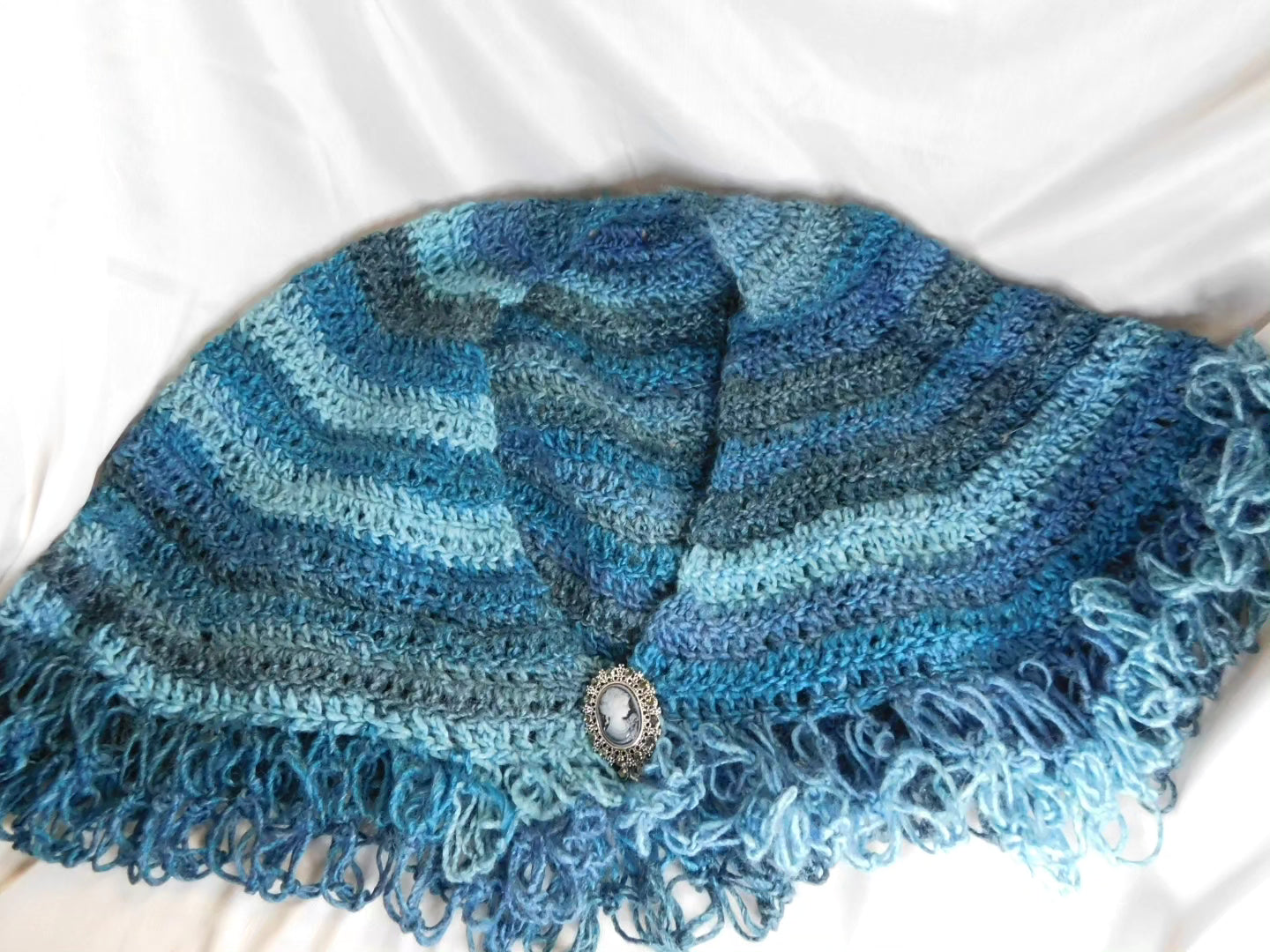 Blue shawl with cameo clasp